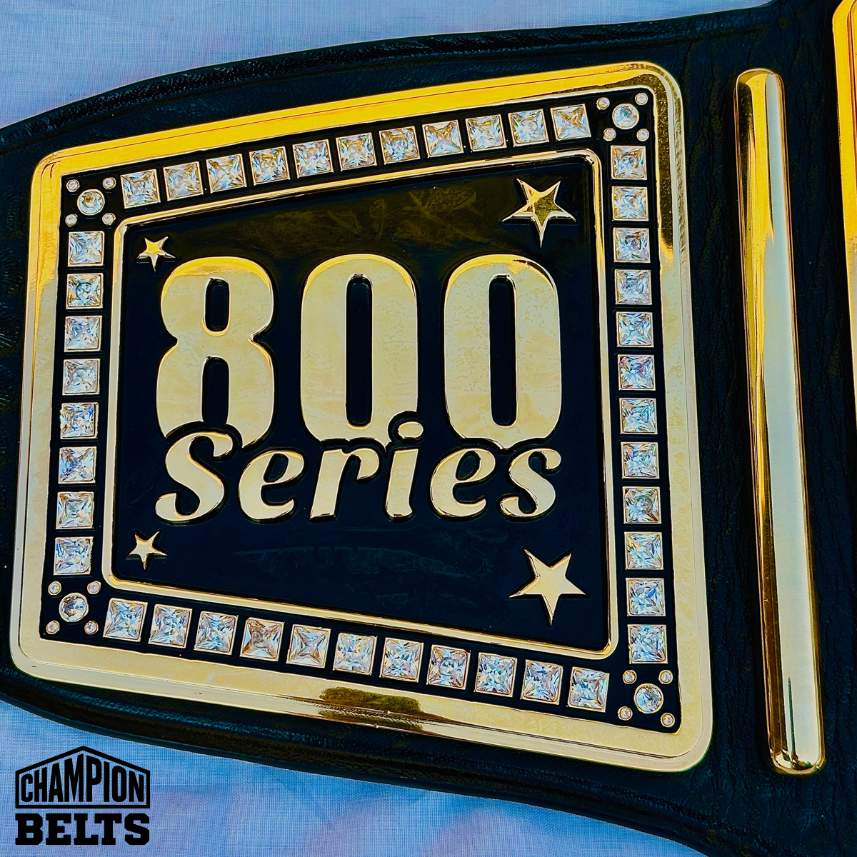 Custom bowling championship belt left side plates with personalized text, logos, stars, and crystal-style accents