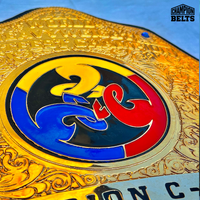 Splatfest World Heavyweight Championship Belt with ornate gold plates, colorful center logo, raised lettering, blue crystal accents, and black strap
